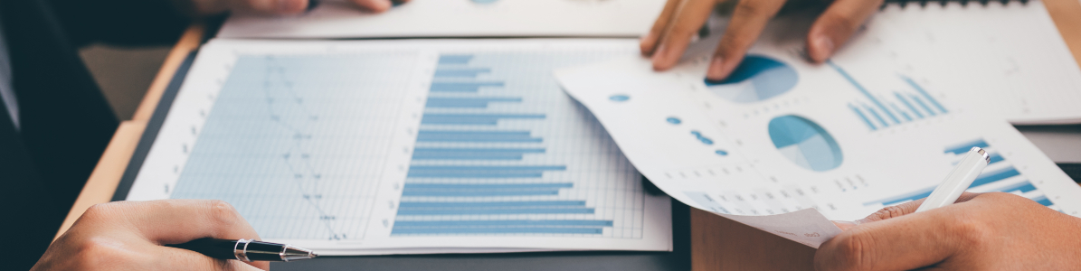 Business people analysing summary graph report header